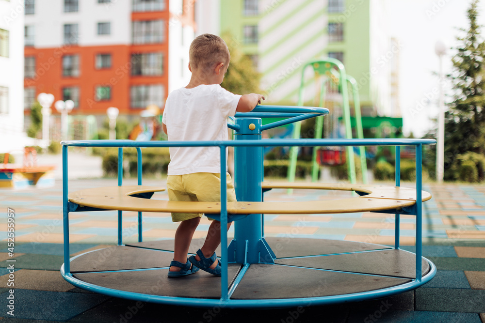 Naklejka premium child playing on the playground