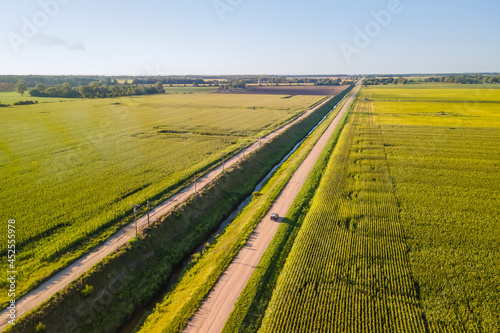 Aerial view of dirt road between Soy bean fields in rural Michigan © SNEHIT PHOTO