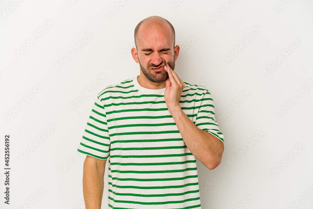 Young bald man isolated on white background having a strong teeth pain, molar ache. Young bald man isolated on white background having a strong teeth pain, molar ache.