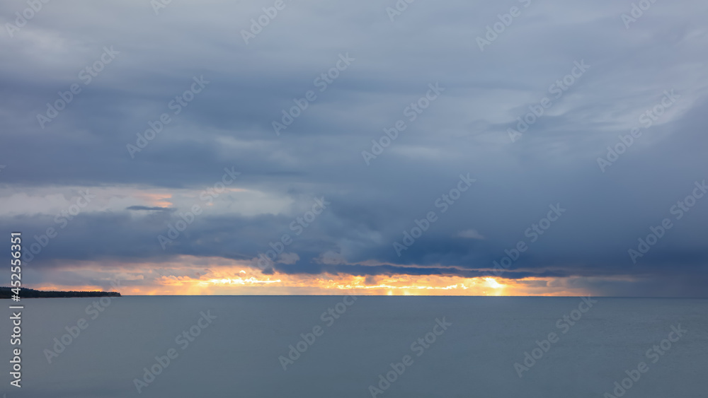 Dark dramatic sky over lake Superior near Michigan north coast line