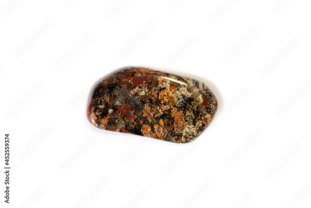 Red and multicolored jasper polished tumblestones narrow focus line, shallow depth of field macrophoto Red and multicolored jasper polished tumblestones narrow focus line, shallow depth of field macrophoto