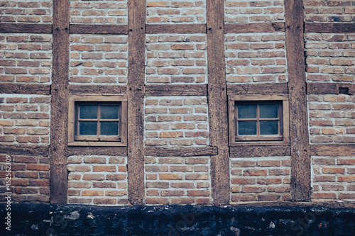 Detail of an old Limburg half-timbered house with 2 windows in the masonry outer wall.