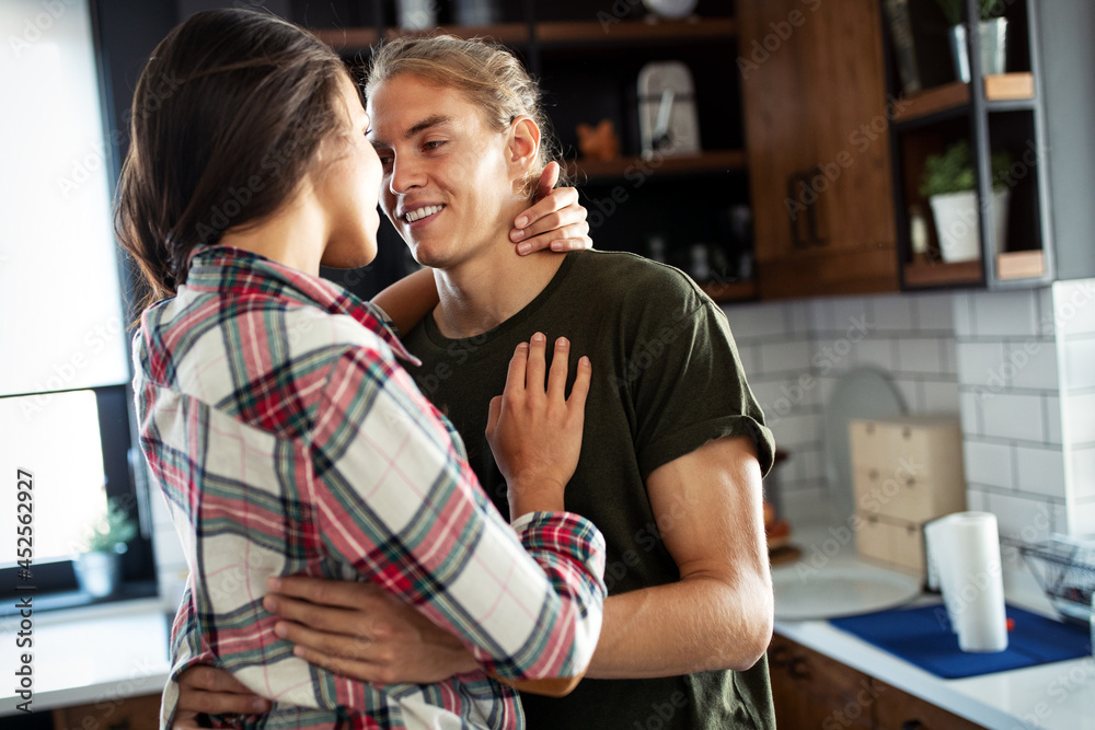 Beautiful couple is hugging and smiling while spending time together Beautiful couple is hugging and smiling while spending time together