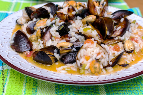 Cooked rice risotto with mussels and shrimps