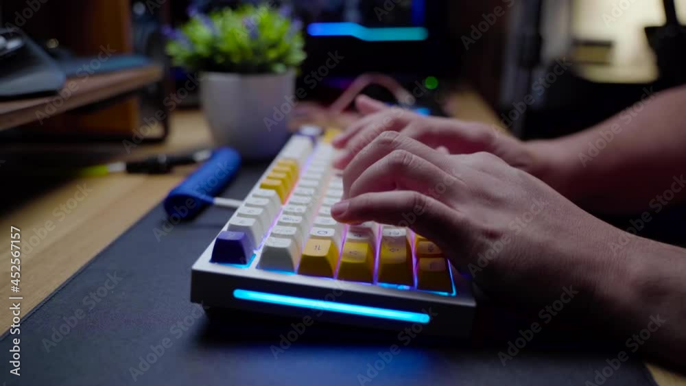 Footage of a man hand typing on his mechanical gaming RGB keyboard with stylish keycaps with ASMR thocc sounds