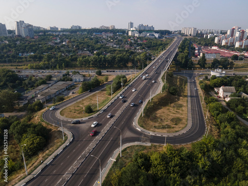 Aerial Top View of highway intersection junction summer morning with car