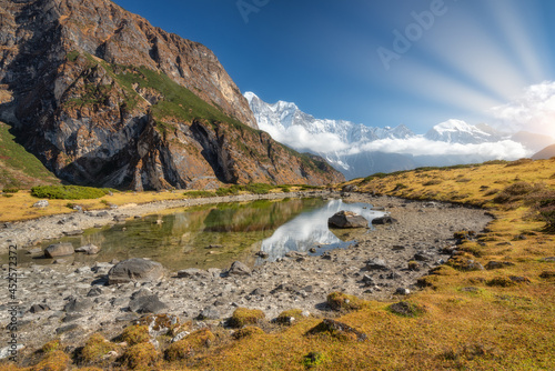 Mountain and lake at sunris...