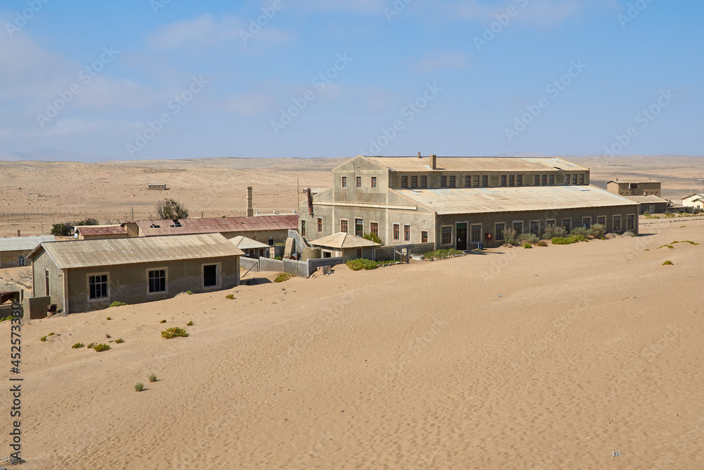 Abandoned buildings in Kolmanskop ghost town in Namib desert, Namibia, Africa. Abandoned buildings in Kolmanskop ghost town in Namib desert, Namibia, Africa.