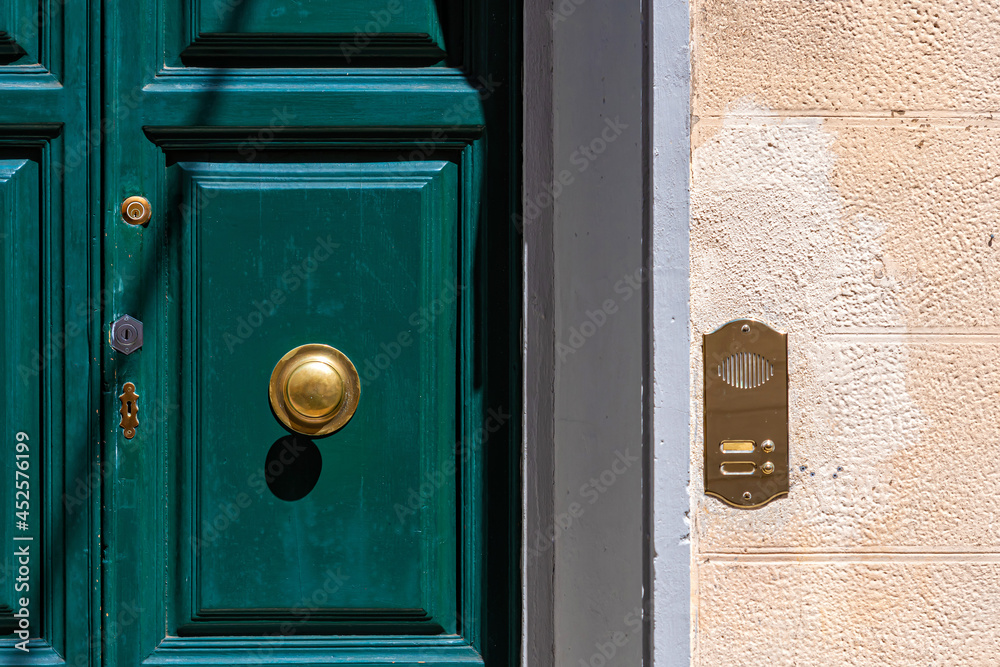 ancient Italian door knob on wooden door ancient Italian door knob on wooden door