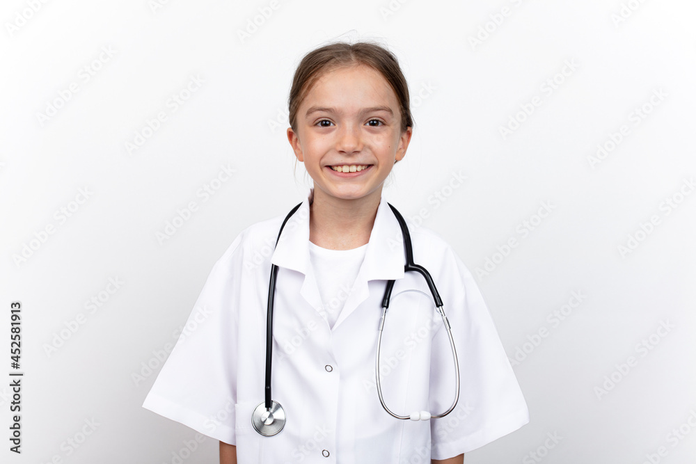 Portrait of child girl dressed in white doctor costume with stethoscope. isolated on white background.
Portrait of child girl dressed in white doctor costume with stethoscope. isolated on white background.