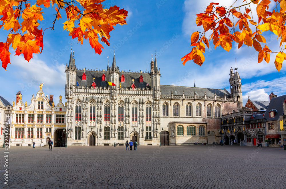 Fototapeta premium Brugge Town Hall and Basilica of Holy Blood on Burg square in autumn, Bruges, Belgium