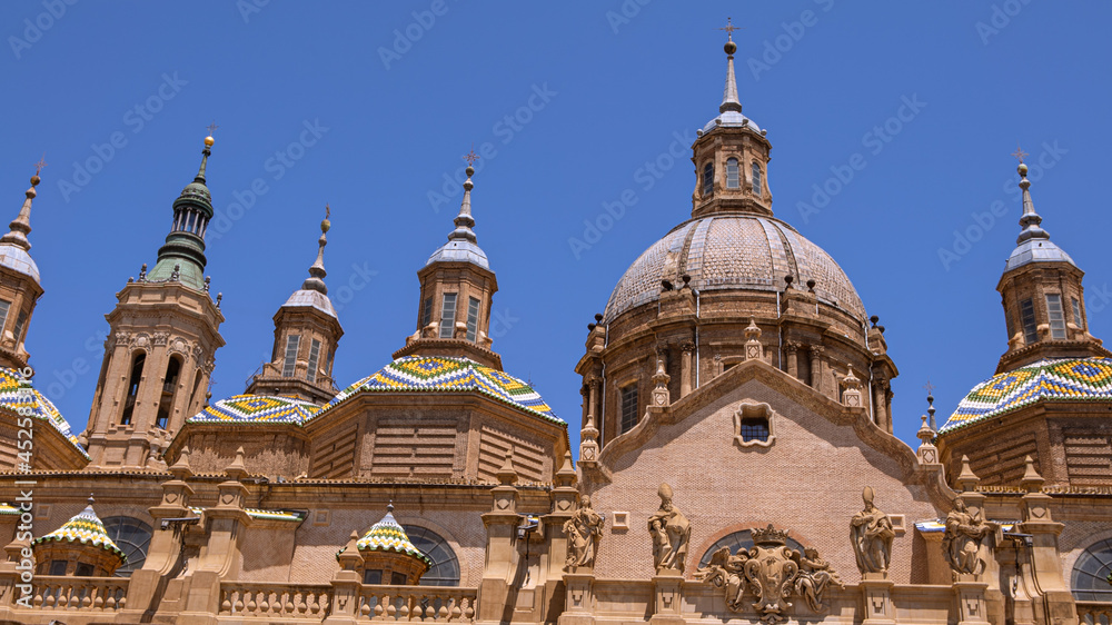 Cityscape view on the roofs and spires of basilica of Our Lady in Zaragoza city.