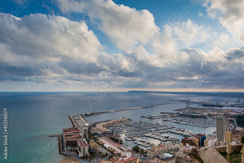 Aerial view of alicante harbor on a cloudy day from santa barbara castle in spain 