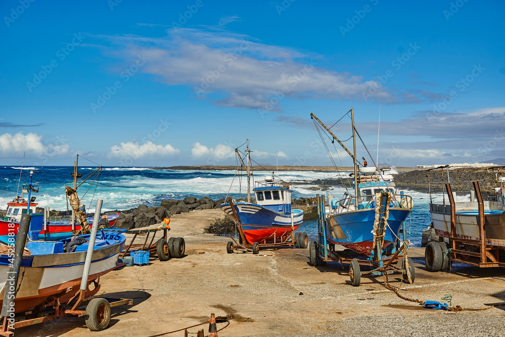 Boats on rusty trailers on seashore Boats on rusty trailers on seashore