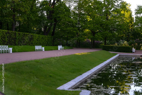 Wallpaper Mural Summer landscape. Beautifully trimmed lawns, trees and metal benches Torontodigital.ca
