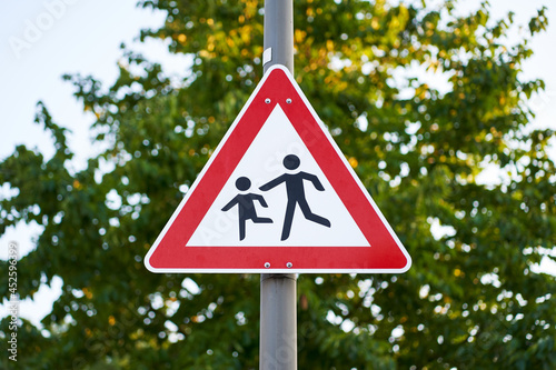 Road sign children on a lantern.