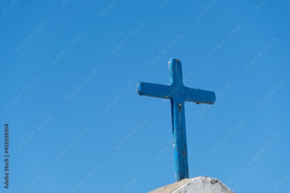Cross of the Church of Nossa Senhora da Nazaré located in Saquarema, Rio de Janeiro. Sunny day with blue sky in the background