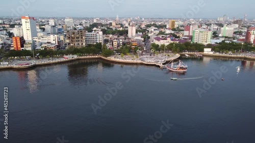 Makassar, South Sulawesi, Indonesia - Aerial Drone 99 Domes Mosque, SkyScrapers City scape and Losari Bay photo