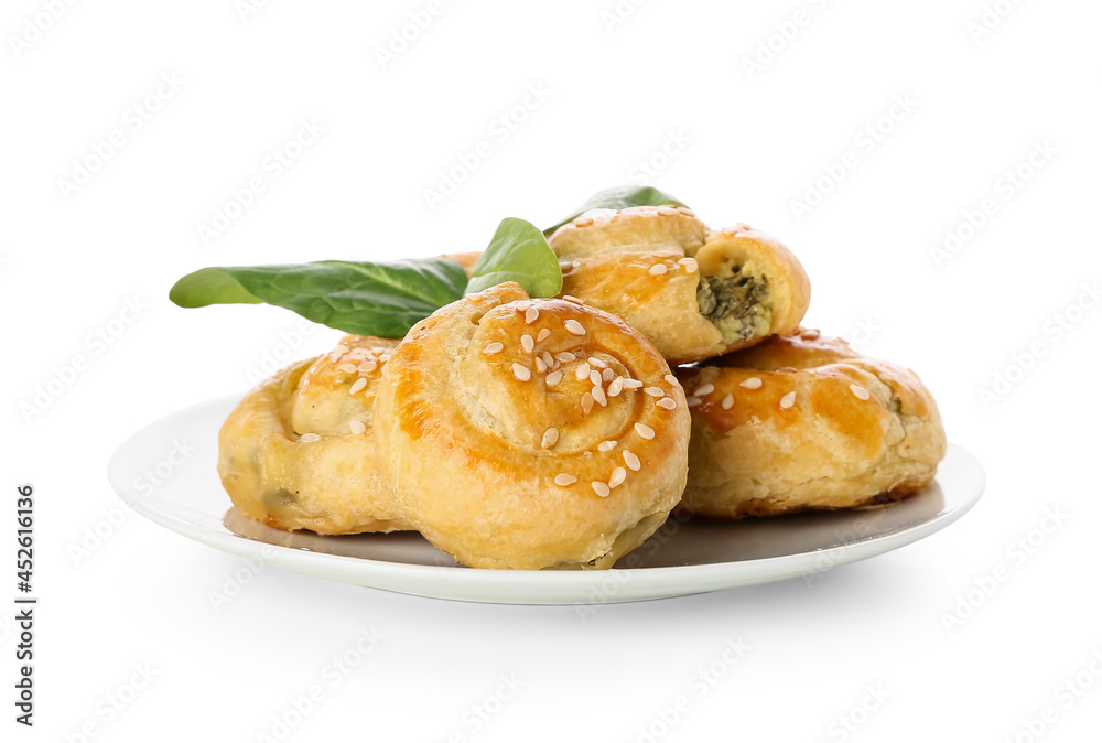 Puff pastry stuffed with spinach on white background