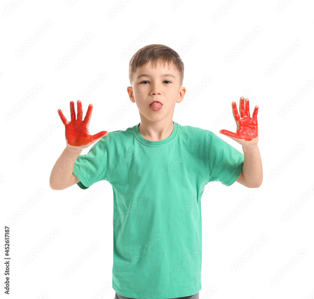 Little boy with hands in paint showing tongue on white background Little boy with hands in paint showing tongue on white background