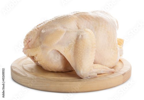 Board with whole raw chicken on white background