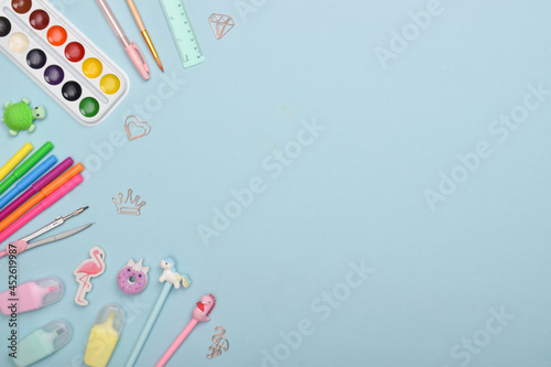 Background with stationery on a light blue background with a space for text. Back to school.
