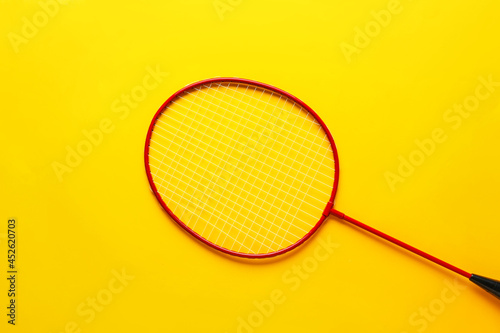 Badminton racket on color background © Pixel-Shot
