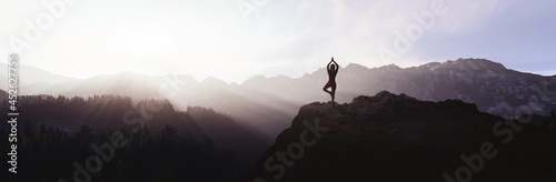 woman doing yoga on the mountain