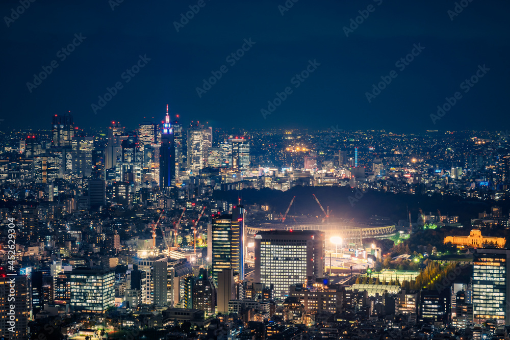 Aerial view from the observation deck at Roppongi Hills Mori Tower in Tokyo at night with the view of Tokyo Olympic Stadium when under construction in 2018 in Japan.