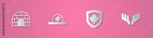 Set paper cut Igloo ice house, Canadian ranger hat, Canada flag on shield and Deer antlers icon. Paper art style. Vector