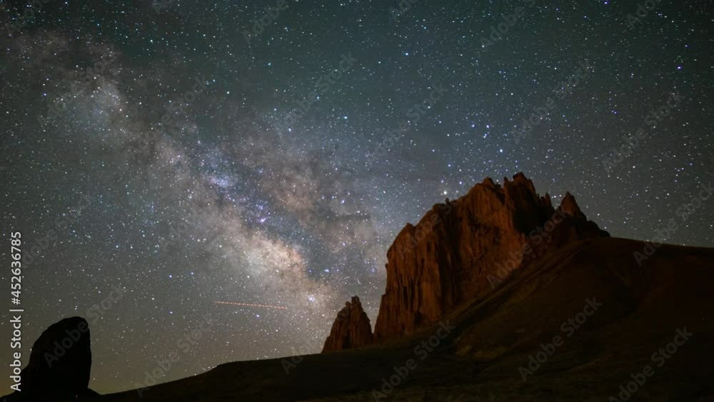 Time lapse of Milky Way galaxy over massive rocks in Shiprock in New Mexico