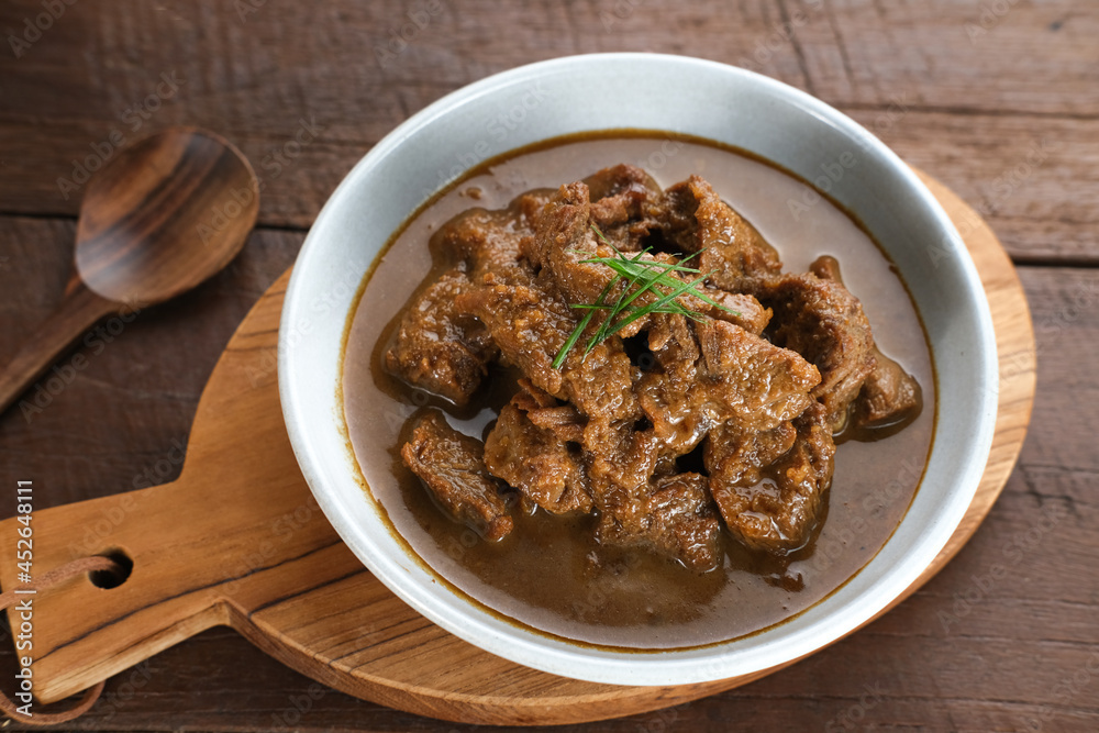 Daging Kelem is a traditional food from Central Java, Indonesia, made from beef, coconut milk and spices. It tastes sweet and savory. Served in bowl, close up.
Daging Kelem is a traditional food from Central Java, Indonesia, made from beef, coconut milk and spices. It tastes sweet and savory. Served in bowl, close up.
