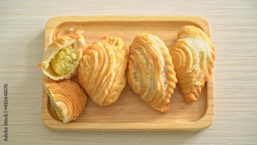 curry puff pastry stuffed beans on wooden plate curry puff pastry stuffed beans on wooden plate