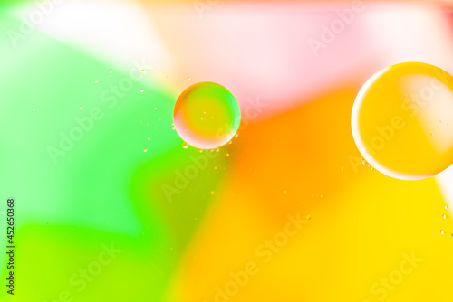Colorful of oil drop floating on the water.Fantastic structure of colorful oil bubbles.