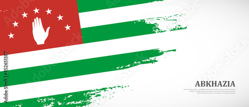 National flag of Abkhazia with textured brush flag. Artistic hand drawn brush flag banner background