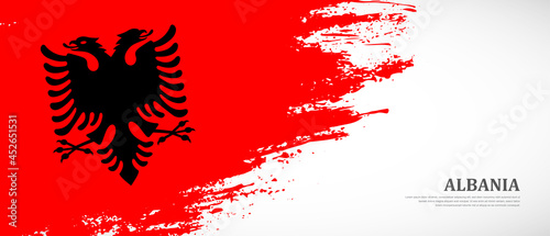 National flag of Albania with textured brush flag. Artistic hand drawn brush flag banner background