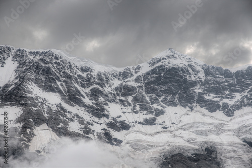 Gestola is one of the peaks of the Bezengi wall of the main Caucasian ridge, the Bezengi region. Mountain peak covered with snow. © Sergei