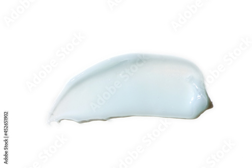 Liquid blue cream smear isolated on white background. Beauty cosmetic smudge such as hair conditioner, creamy lotion, facial retinol serum, mask balm, cleanser, shower gel or shampoo top view