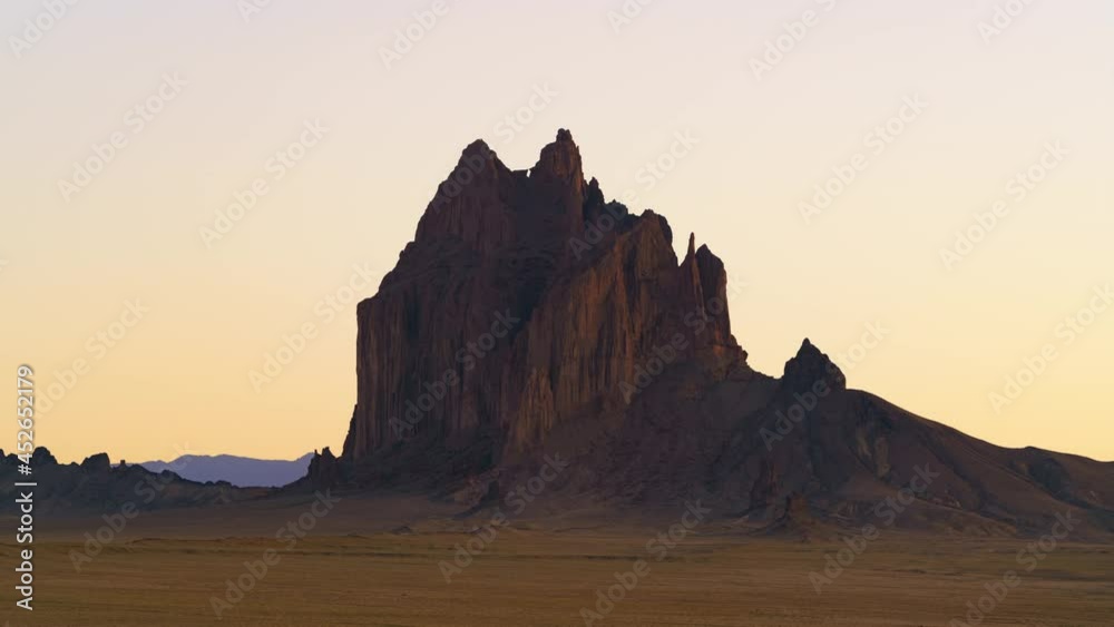 Time lapse of massive rocks at sunset in Shiprock in New Mexico Time lapse of massive rocks at sunset in Shiprock in New Mexico