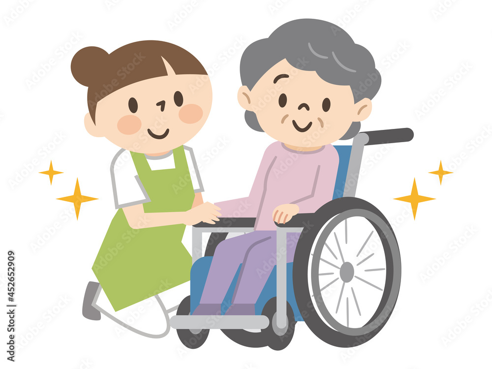 車椅子のシニア女性と若い介護スタッフ 車椅子のシニア女性と若い介護スタッフ