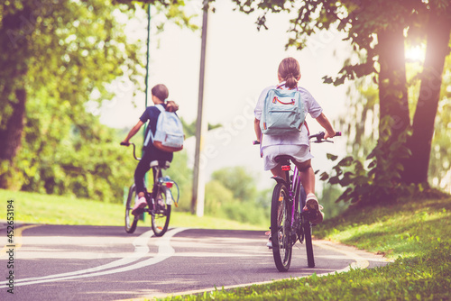 Cyclists ride on the bike path in the city Park 