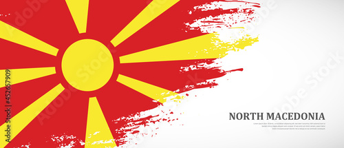 National flag of North Macedonia with textured brush flag. Artistic hand drawn brush flag banner background
