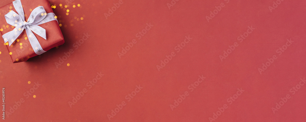 Gift boxe with white bow on a red backdrop. Gift boxe with white bow on a red backdrop.