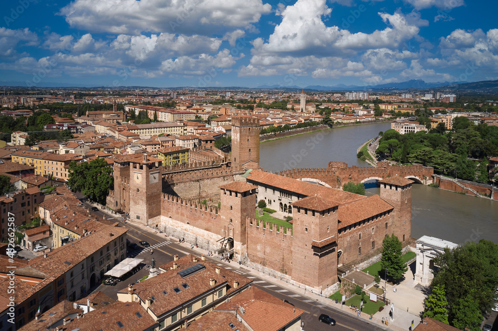 Verona in the region of Venice, Italy. Historic Castelvecchio Bridge, Ponte di Castelvecchio in Verona Italy. Bridge over the Adige river in Verona. Panorama of the Ponte di Castelvecchio bridge.