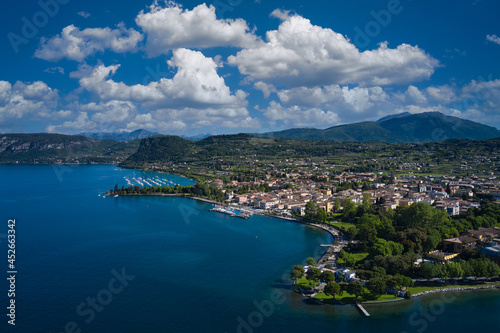 Panorama of the historic town of Bardolino. Aerial view of Bardolino, Lake Garda, Italy. Top view of the historic part of the city of Bardolino on the coastline of Lake Garda.