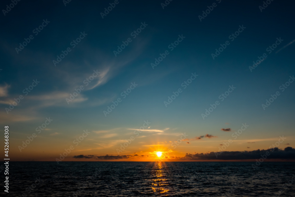  Sunset by the sea. Gentle waves, a view of the calm sea. Made in climatic lighting conditions.