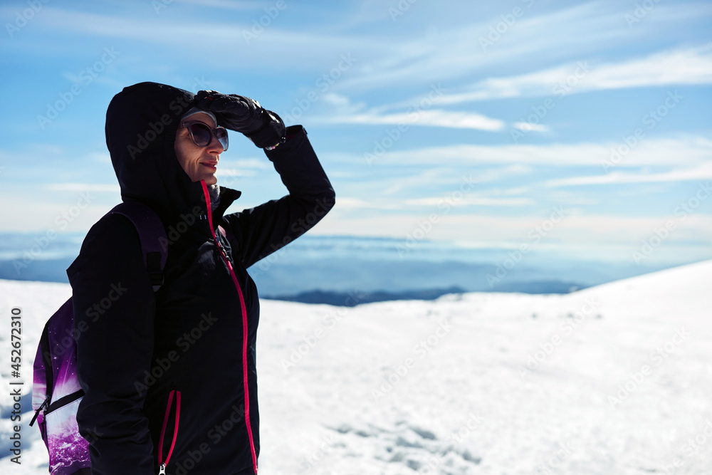 Woman enjoying on a mountain winter fresh air. Woman enjoying on a mountain winter fresh air.