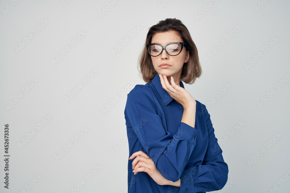 elegant woman with glasses in blue shirt fashion light background elegant woman with glasses in blue shirt fashion light background