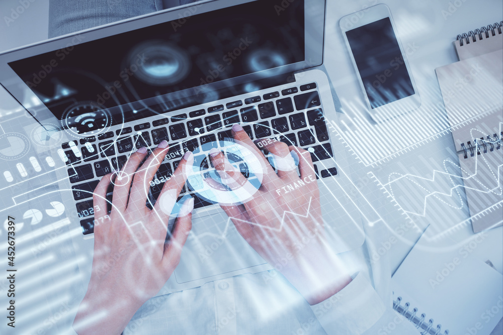 Double exposure of woman hands working on computer and tech theme hologram drawing. Top View. Technology concept. Double exposure of woman hands working on computer and tech theme hologram drawing. Top View. Technology concept.
