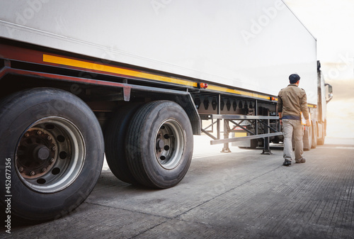Semi Trailer Truck the Parking with Truck Driver. Industry Cargo Freight Truck Transport and Logistics. Checking the Truck's Safety Maintenance Inspection Truck Safety of Semi Truck Wheels Tires. 